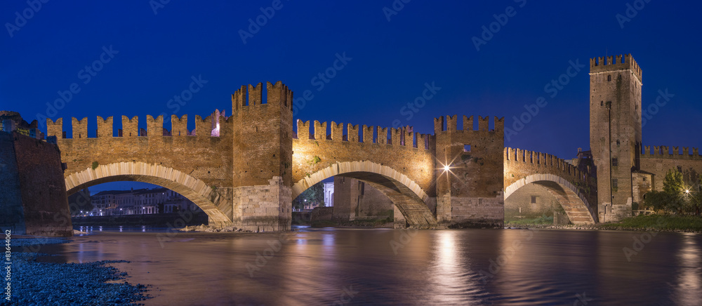 night lights and reflections of castle in Verona in Italy