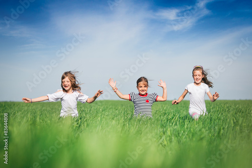 Little girls running on the field