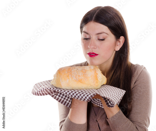 woman holding homemade fresh baked bread