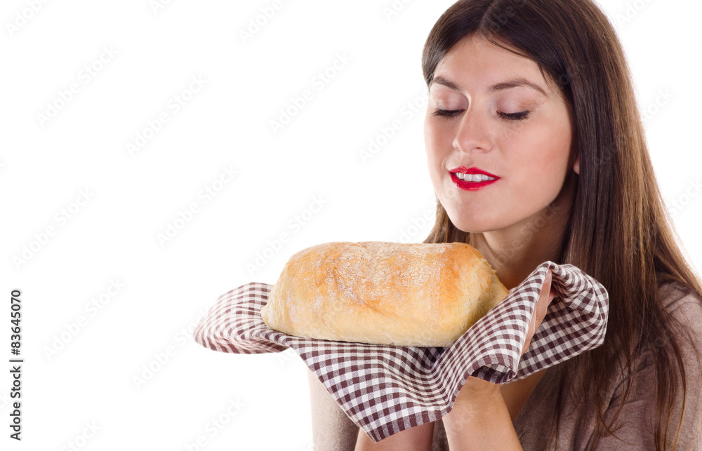 Young smiling woman holding homemade fresh baked bread Young smiling woman holding homemade fresh baked bread