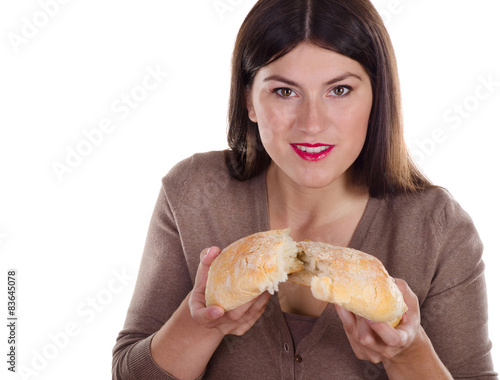 smiling woman holding homemade fresh baked bread