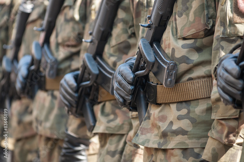 Army parade - armed soldiers in camouflage military uniform