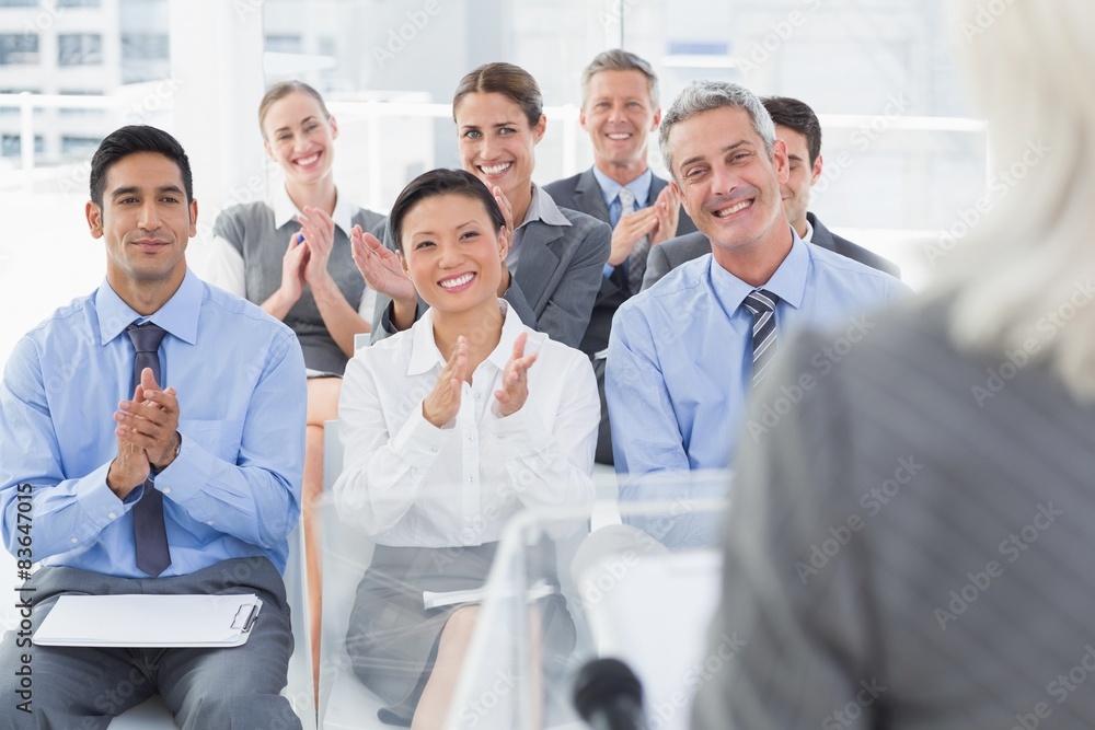 Business people applauding during meeting Business people applauding during meeting