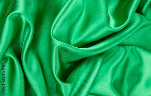 Green silk cloth with some soft folds.