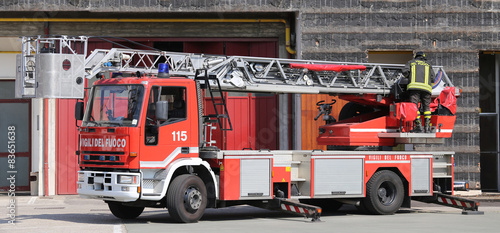 red truck with metal scale of firefighters in the Firehouse