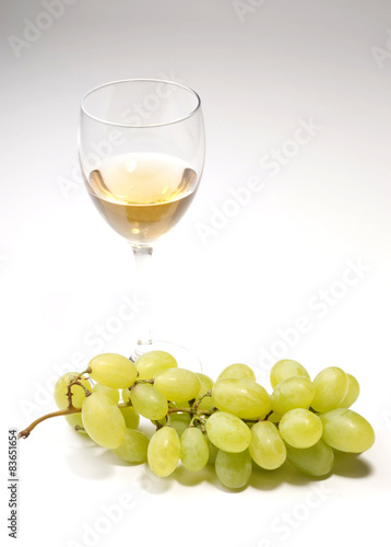 white wine  with bunches of grapes