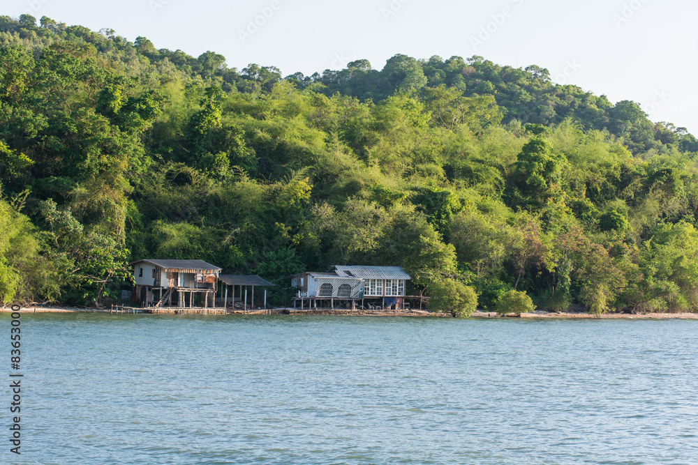 Naklejka premium Old house on stilts over the sea