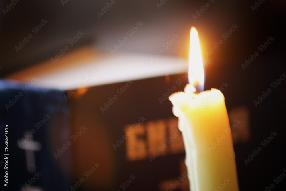 Fototapeta burning candle and bible religion