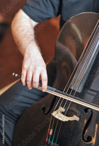 Man playing the cello, hand close up