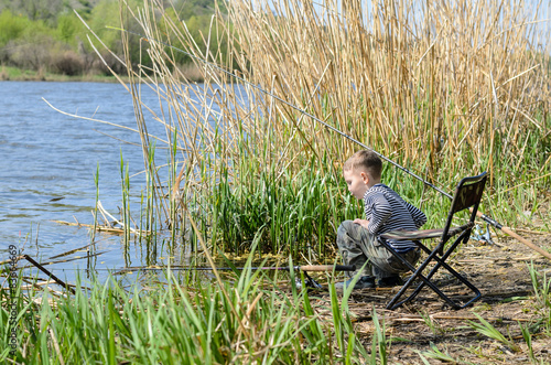 Young boy fishing with a rod and reel