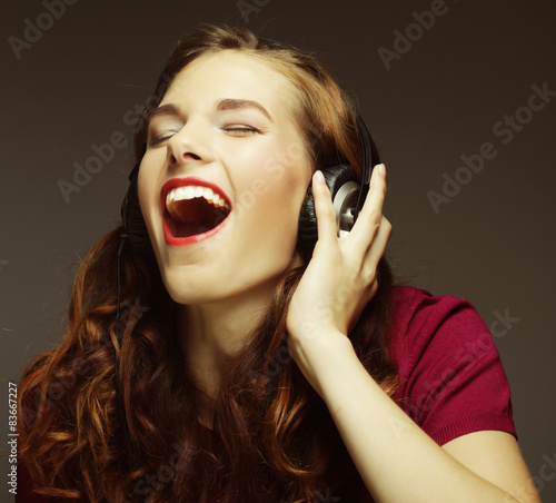 Young woman with headphones listening music 