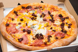 Pizza with ham corn and sausages