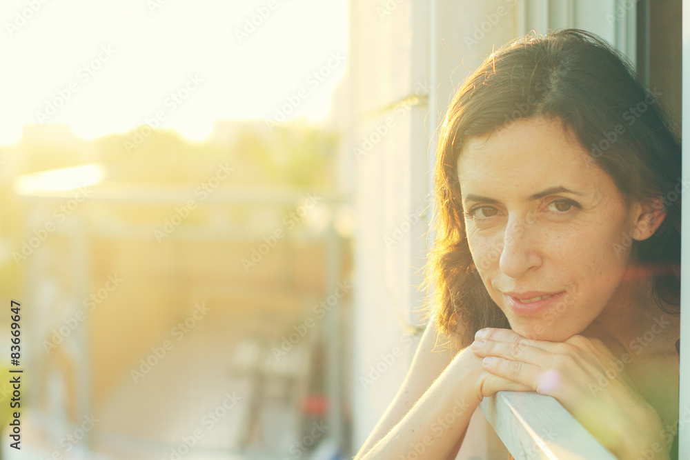Portrait of beautiful 35 years old woman on sunset colors