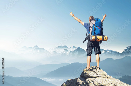 Tourist on mountain peak. Sport and active life concept