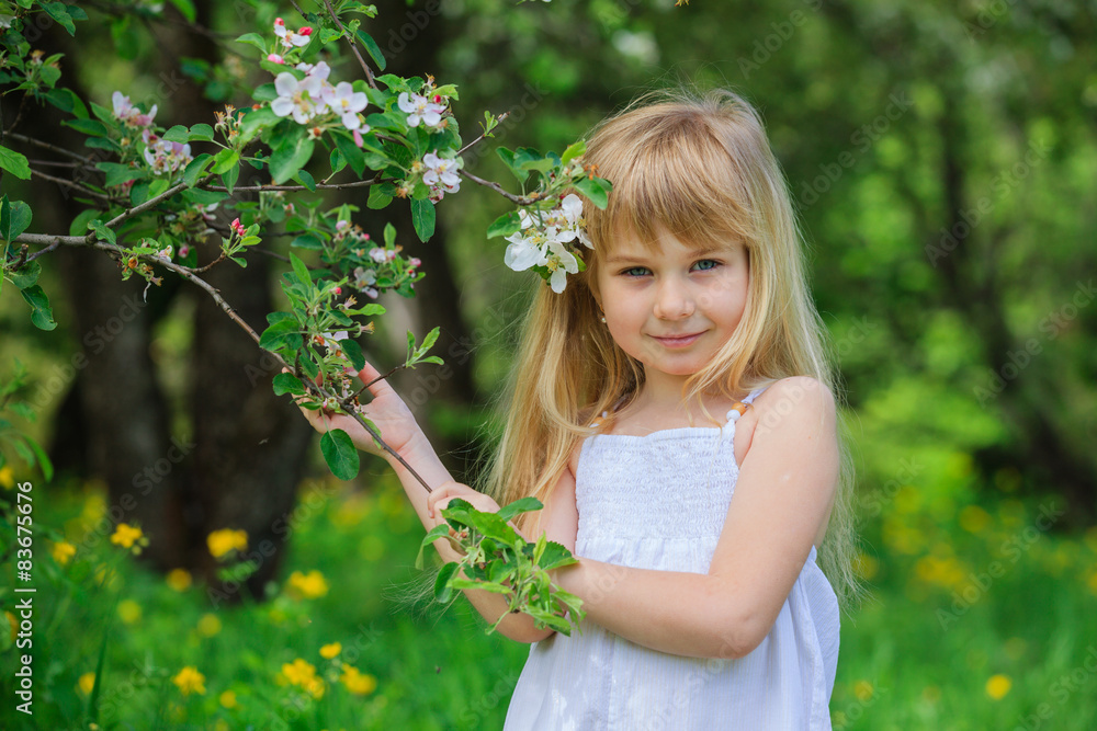 Girl in blooming apple tree garden Girl in blooming apple tree garden
