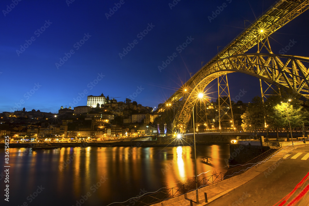 View of the historic city of Porto, Portugal at night time.