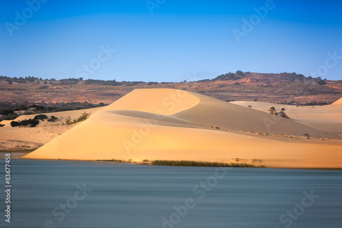 Fototapeta Naklejka Na Ścianę i Meble -  White sand dunes with blue skies, Mui Ne, Vietnam