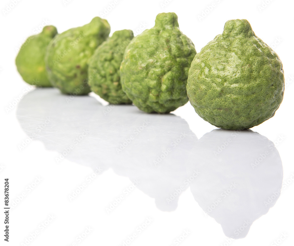 Kaffir or makrut lime over white background Kaffir or makrut lime over white background