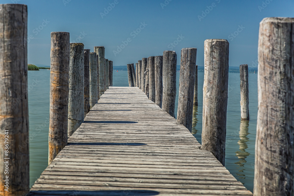 Fototapeta premium Wooden mole on shore.