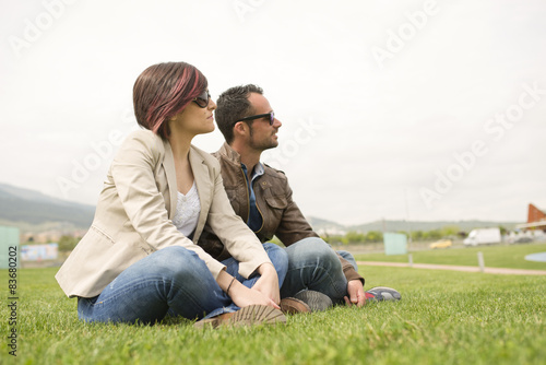 Couple at city park with sunglasses