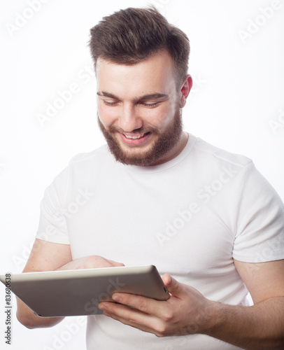 young man  using a tablet computer  © Raisa Kanareva