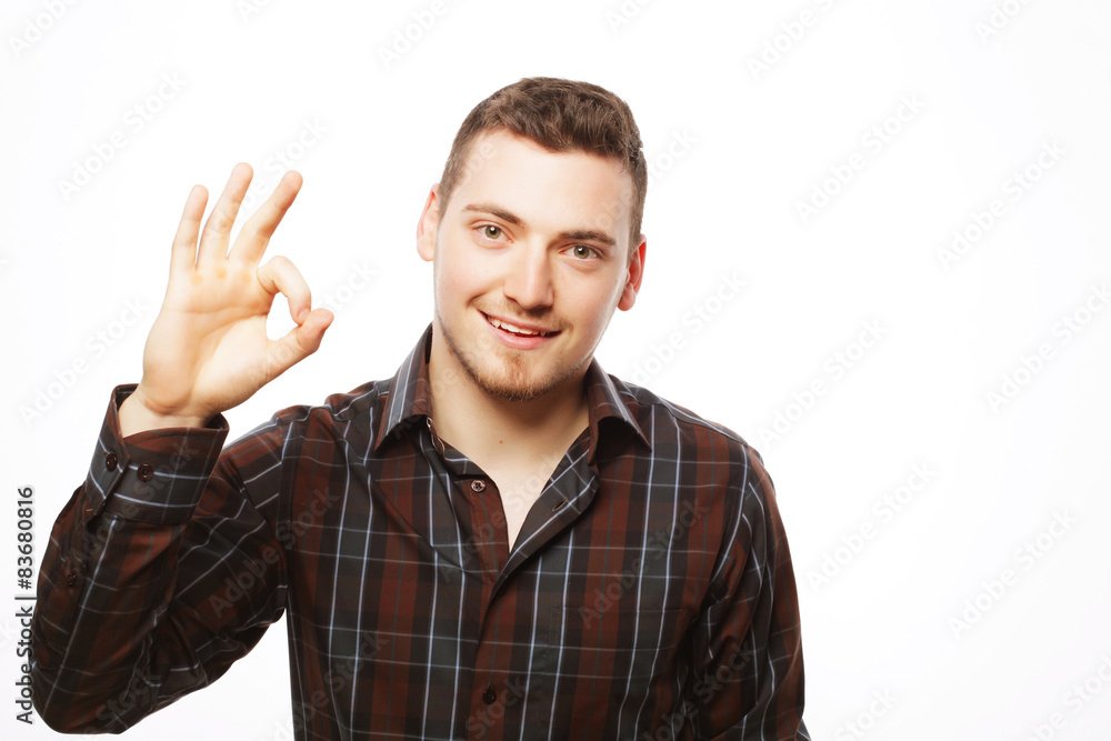 Handsome young man in shirt looking at camera Handsome young man in shirt looking at camera