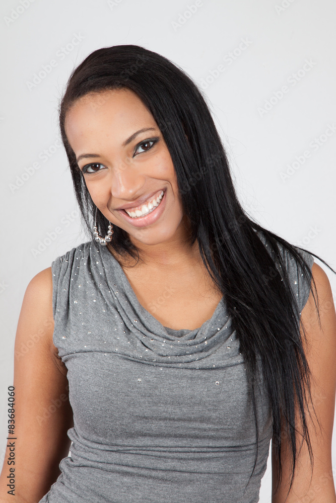 Pretty Black woman with long hair, smiling at the camera Pretty Black woman with long hair, smiling at the camera