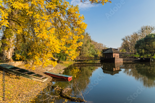 Autumn scenery with a watermill on boat in Slovak town Kolarovo. photo