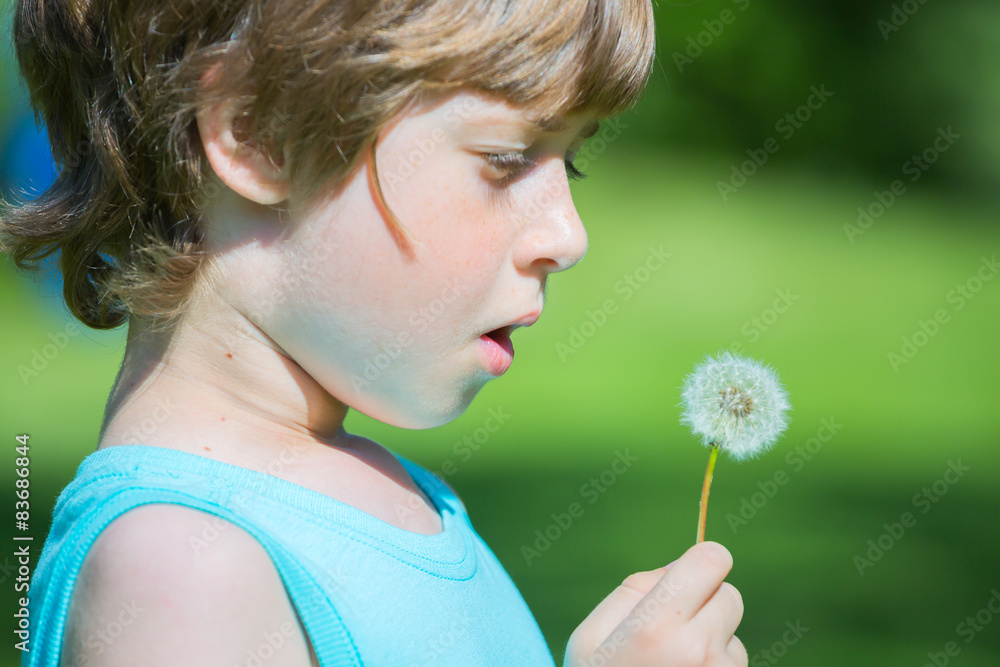 Boy blowing dandelion Boy blowing dandelion