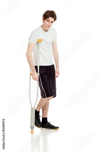 Model shot in studio on white injured with crutch © bruno135_406