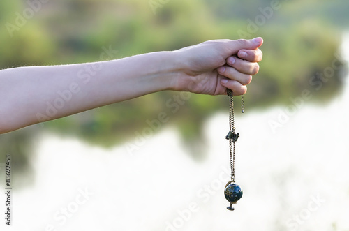 Necklace in the form of globe and binocular