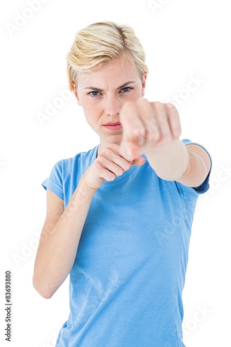 Stern blonde woman pointing with her finger