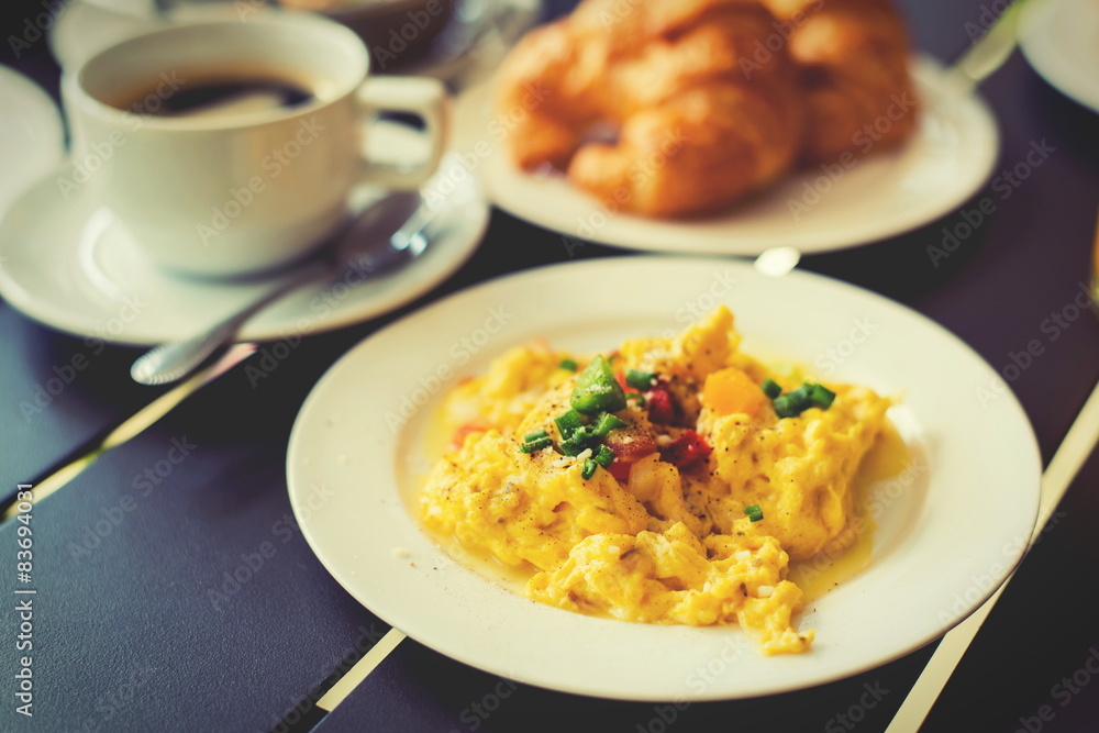 Omelets, breakfast served with coffee and croissants. Omelets, breakfast served with coffee and croissants.