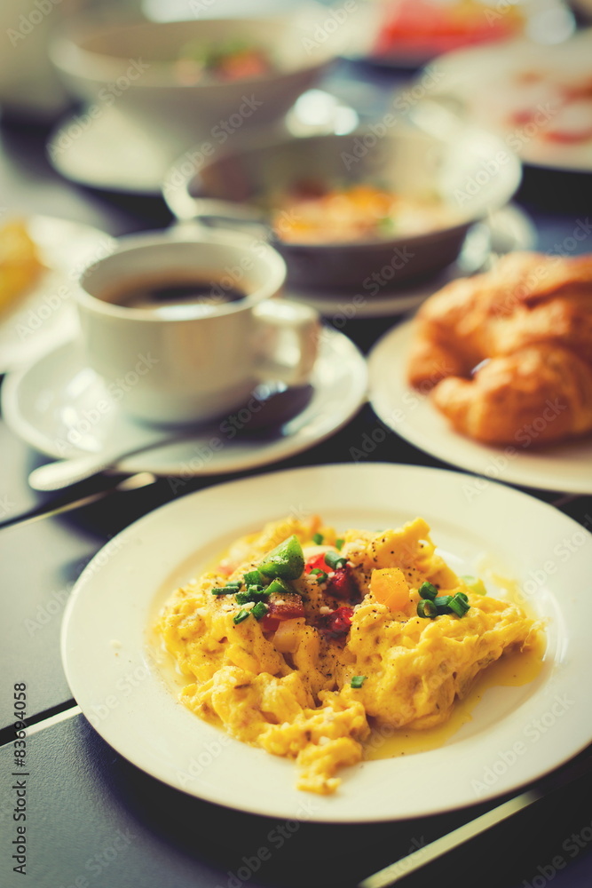 Omelets, breakfast served with coffee and croissants.