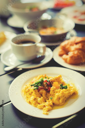 Omelets, breakfast served with coffee and croissants.