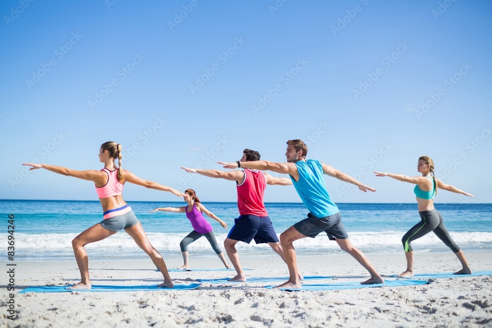 Friends doing yoga together with their teacher Friends doing yoga together with their teacher