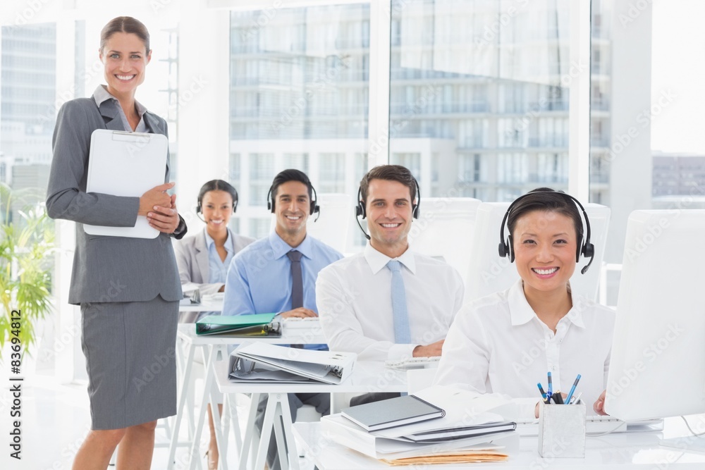 Smiling work team using computer Smiling work team using computer