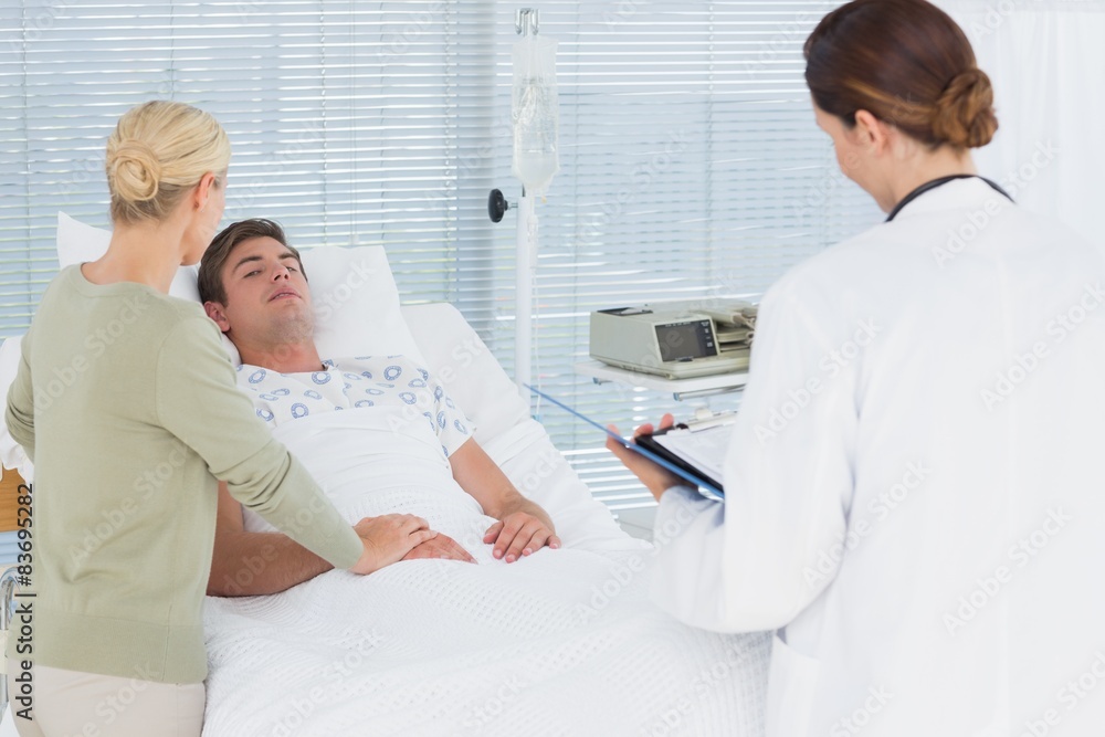 Fototapeta premium Doctors taking care of patient