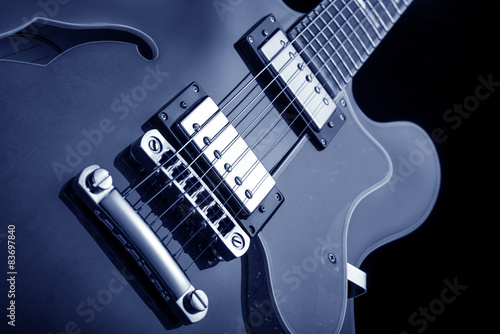 elcectric guitar on blue