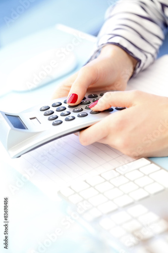 Businesswoman with calculator