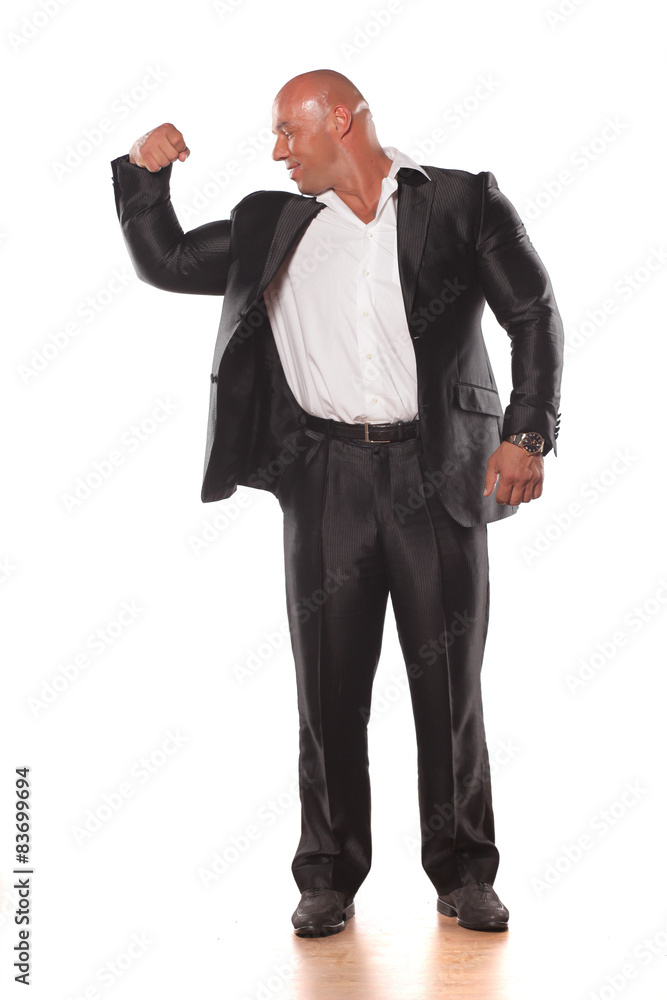 muscular bald man posing in a jacket on a black background muscular bald man posing in a jacket on a black background