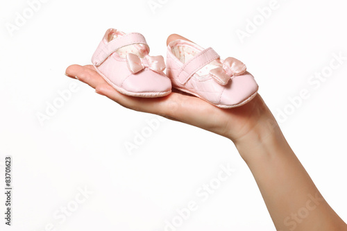 Shoes for girls in the women's hands