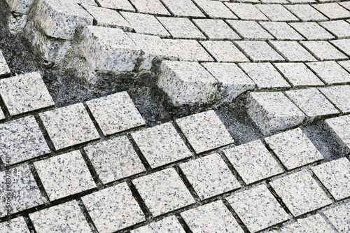 paving stones broken and cracked photo
