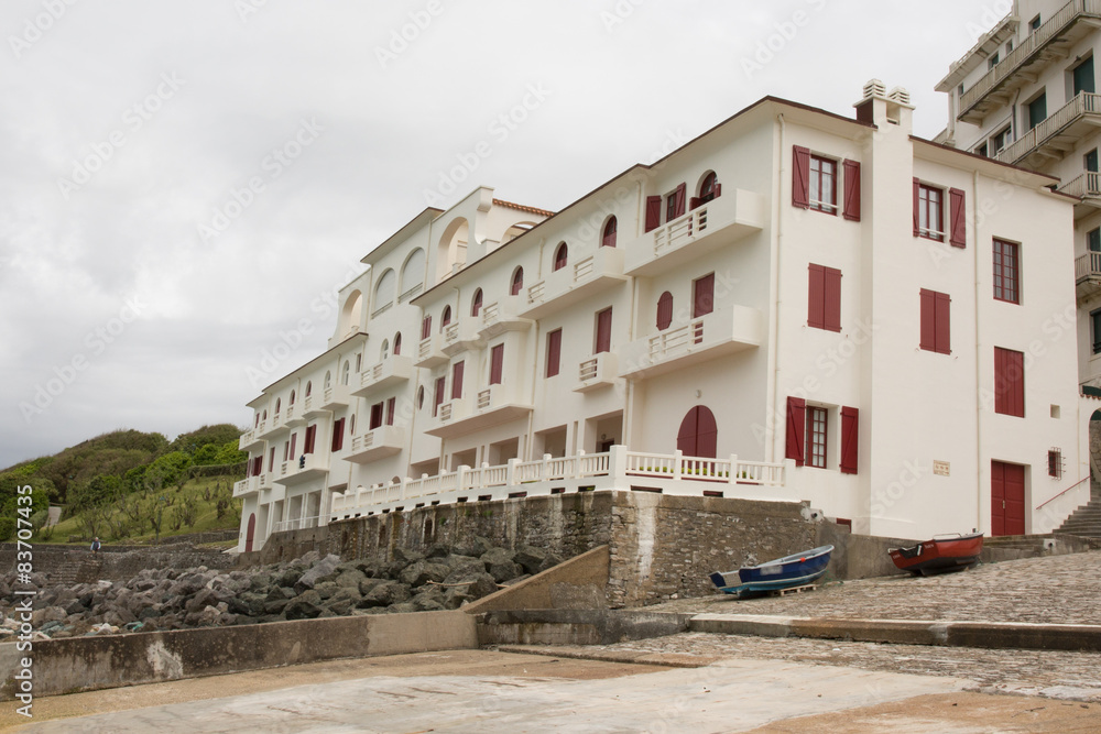 red and white typical Basque hotel by the sea