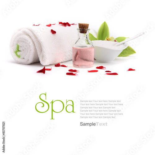 Spa concept. Oil, orchid and towel with red petals. #83707821