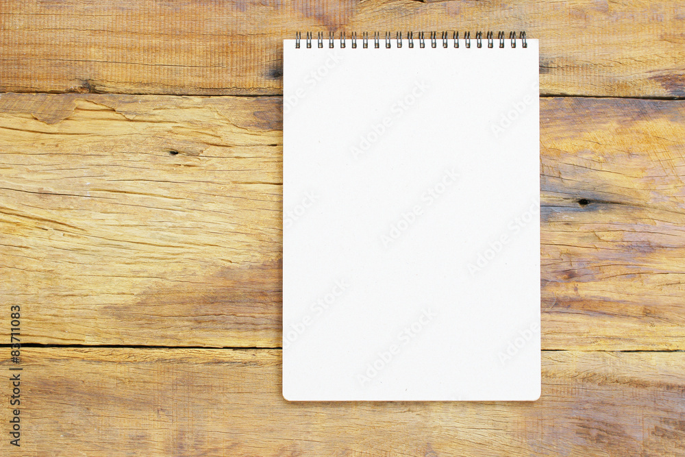 Notebook on wooden table Notebook on wooden table