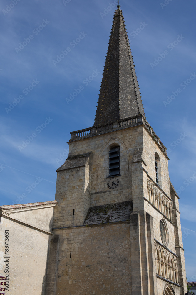 Beautiful top of the church in France under blue sky