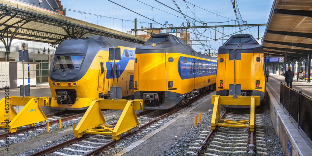 Three Fast Intercity Commuter Trains waiting at a station Three Fast Intercity Commuter Trains waiting at a station
