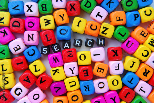 muticolor mixed  letters and black word search photo