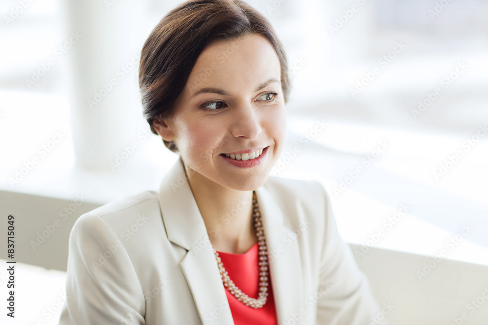 happy elegant young woman in jacket at office
